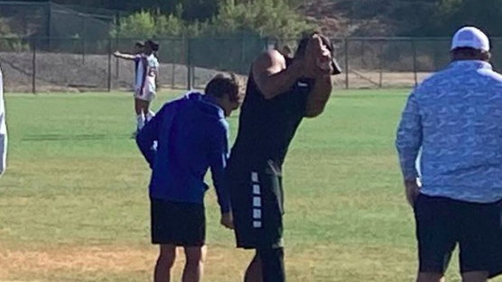 Tiger Woods spotted practise-swinging at kids soccer match